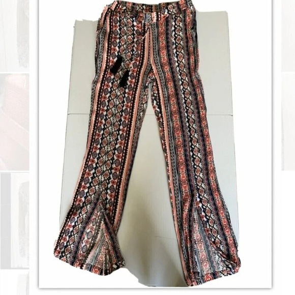 Tribal Jeans. Boho pants with slits at ankle and tassel at waist line. - Picture 1 of 4